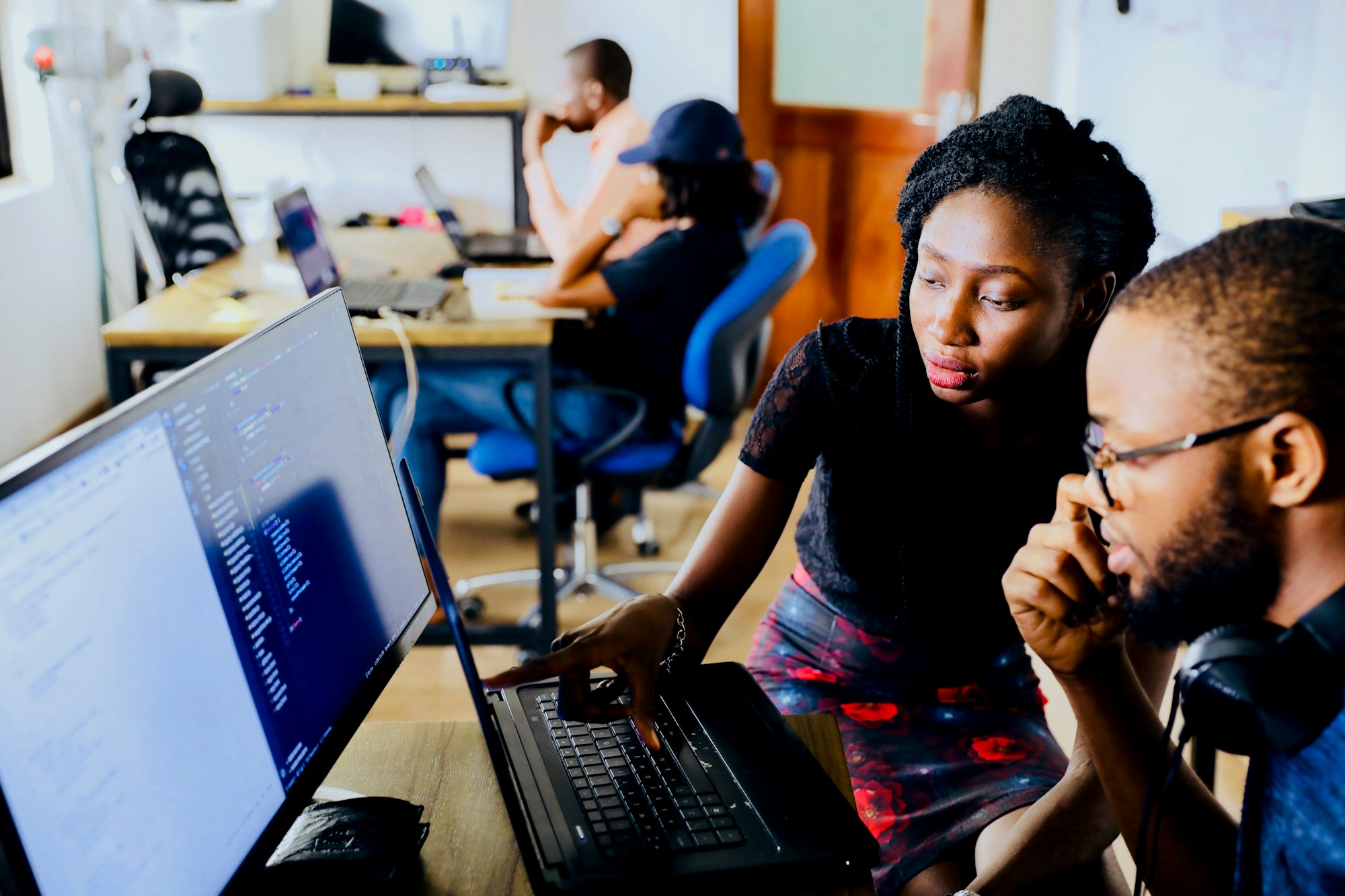 Two engineers pair programming on real code